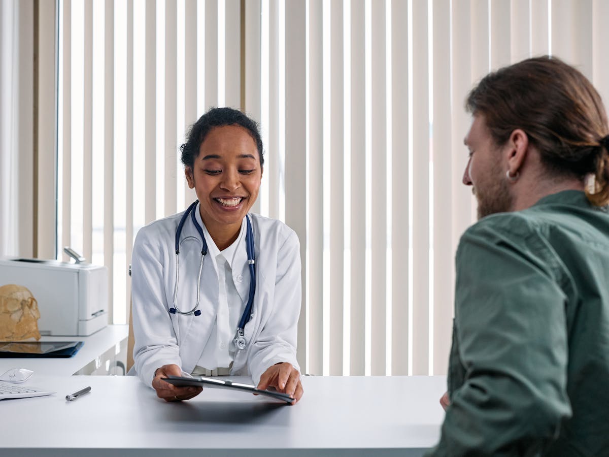 Doctor having a warm, personal conversation with a patient