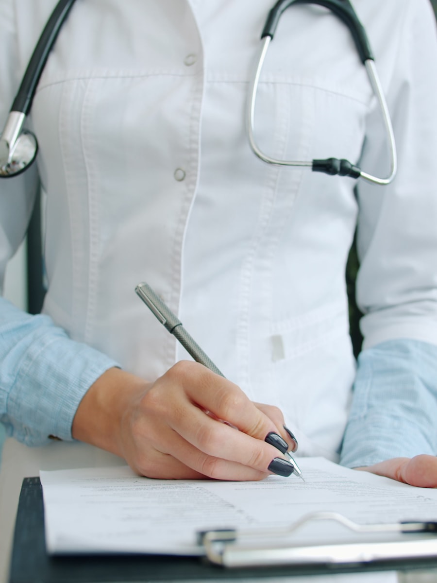 Clinician writing medical documentation