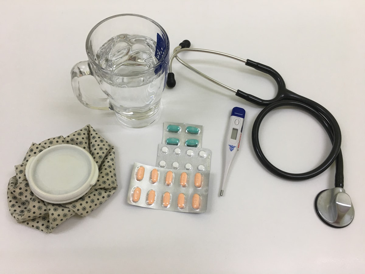 Stethoscope and medications on a desk